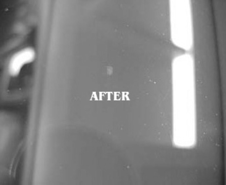 The same windshield chip after repair, barely visible